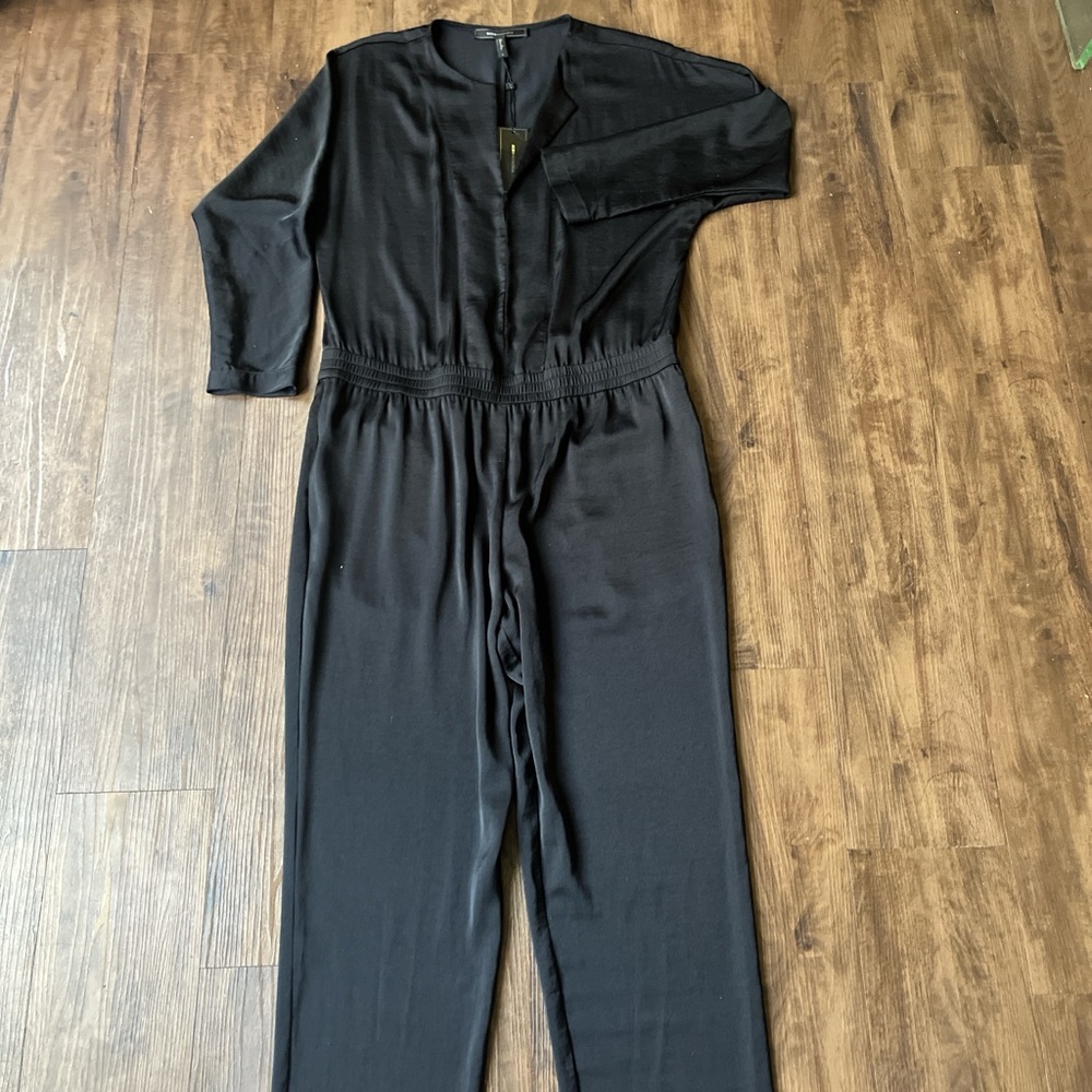 BCBG oversized fit black satin hook and eye jumpsuit.